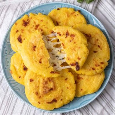 Arepas de Queso een heerlijke combinatie van geroosterde maïs en smeltend kaas!